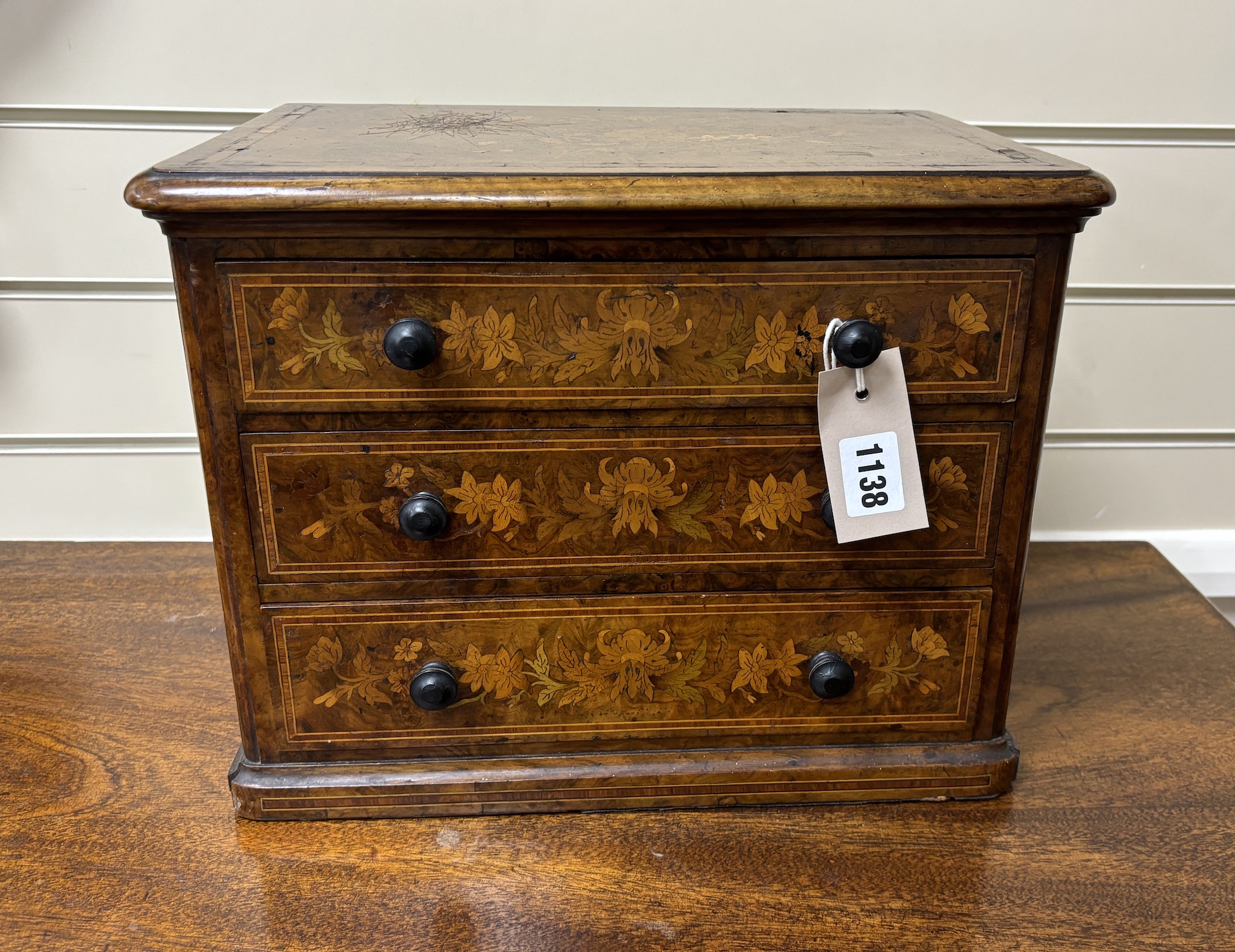 A Victorian floral marquetry inlaid miniature walnut chest, stamped 1863, B Shepherd, width 35cm, depth 24cm, height 27cm